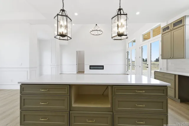 a kitchen with a refrigerator and countertop