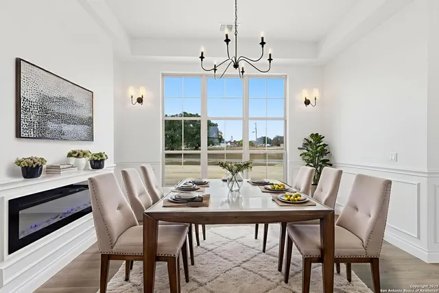 a view of a dining room with furniture window and outside view