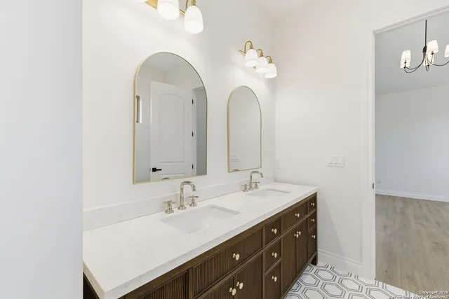 a bathroom with a sink and a mirror