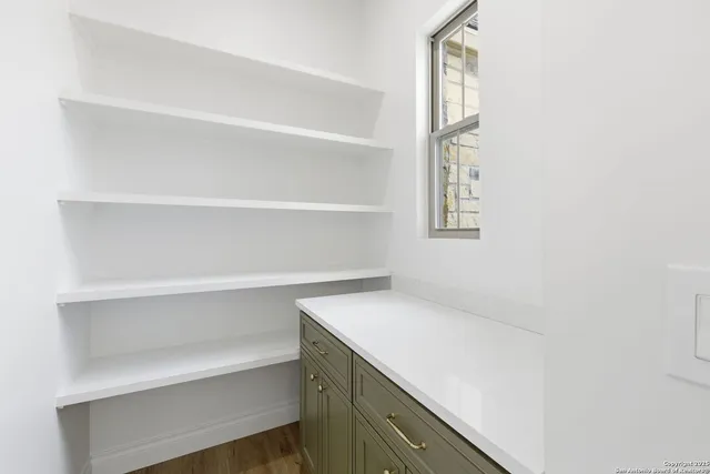 a utility room with cabinets
