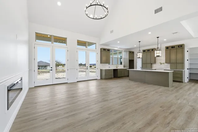 a view of kitchen with cabinets and wooden floor