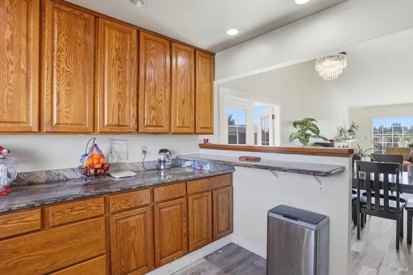 a kitchen with stainless steel appliances a sink stove and cabinets