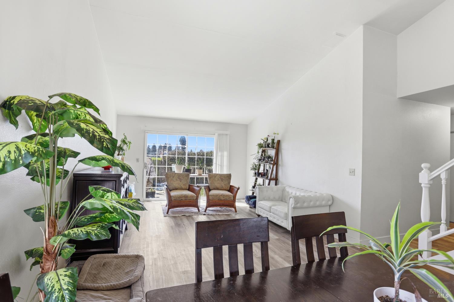 1407 Georgia Court Rohnert Park, CA 94928 - Photo 14 of 36 a living room with furniture potted plant and a potted plant