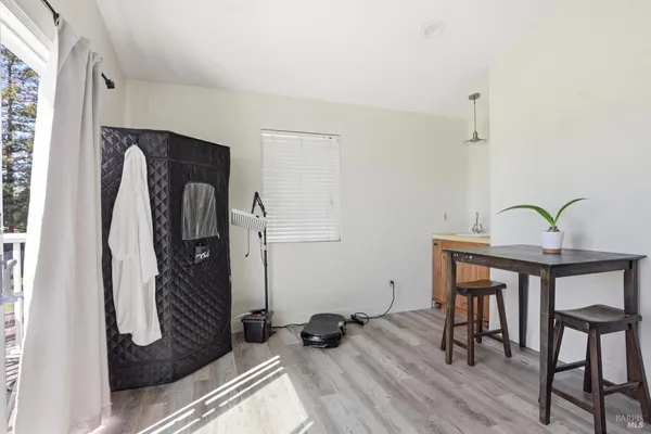 a bedroom with a bed and a painting on the wall