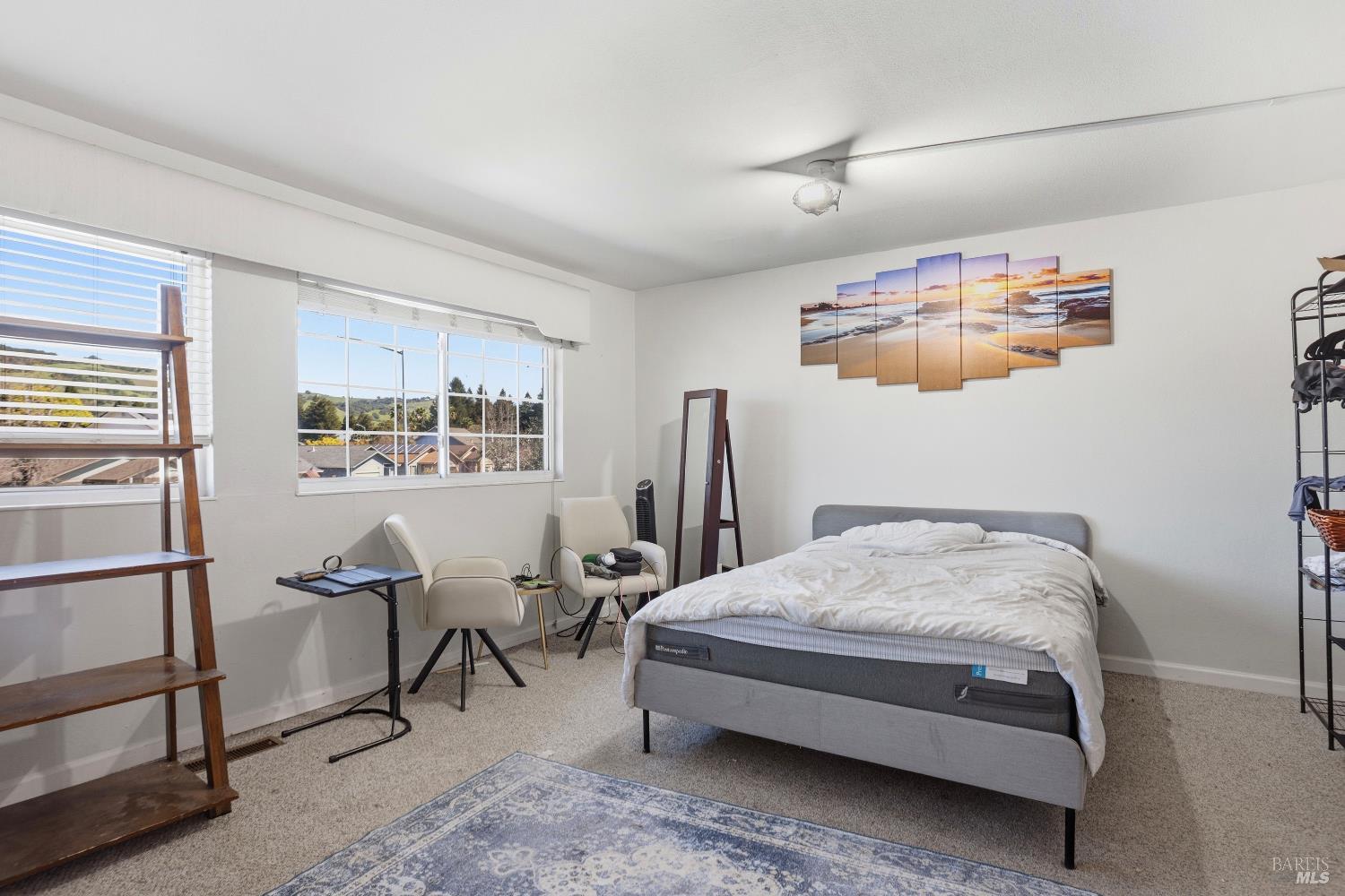 1407 Georgia Court Rohnert Park, CA 94928 - Photo 26 of 36 a bedroom with a bed and wooden floor
