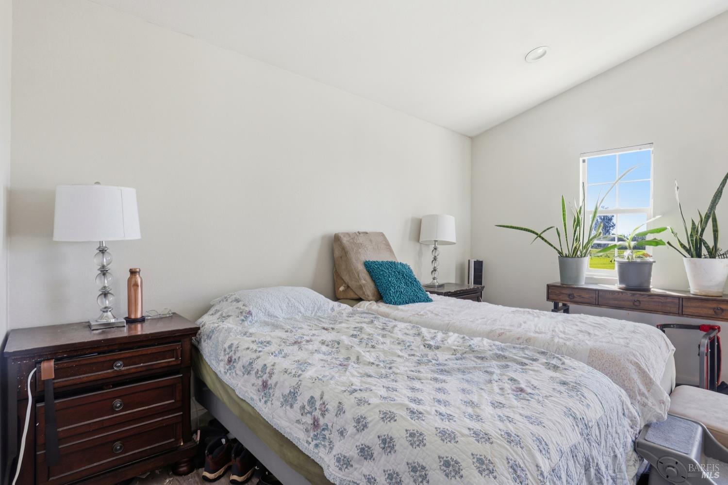 1407 Georgia Court Rohnert Park, CA 94928 - Photo 27 of 36 a bedroom with a bed and dresser with mirror