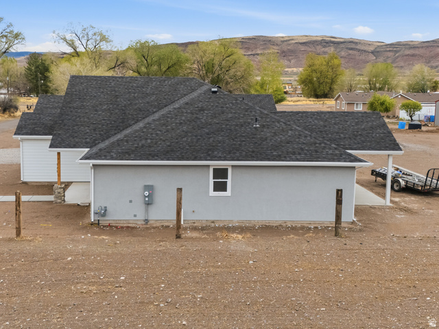 169 West 100 South Joseph, UT 84739 - Photo 5 of 35 View of side of home with a mountain view, stucco siding, and a shingled roof