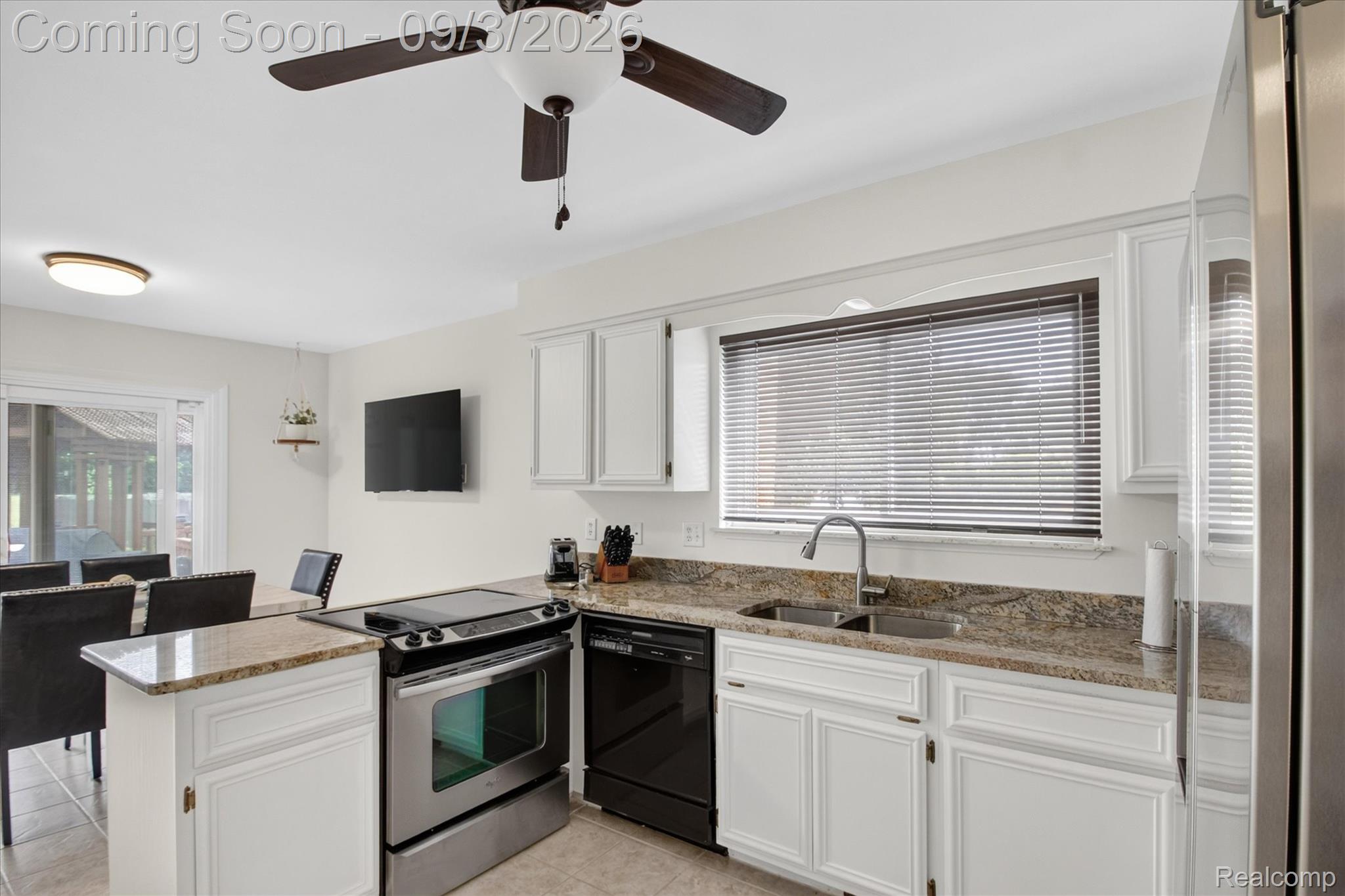 27260 Campbell Road Warren, MI 48093 - Photo 17 of 60 White cabinetry with coordinating countertops, dual basin sink, and stainless steel appliances