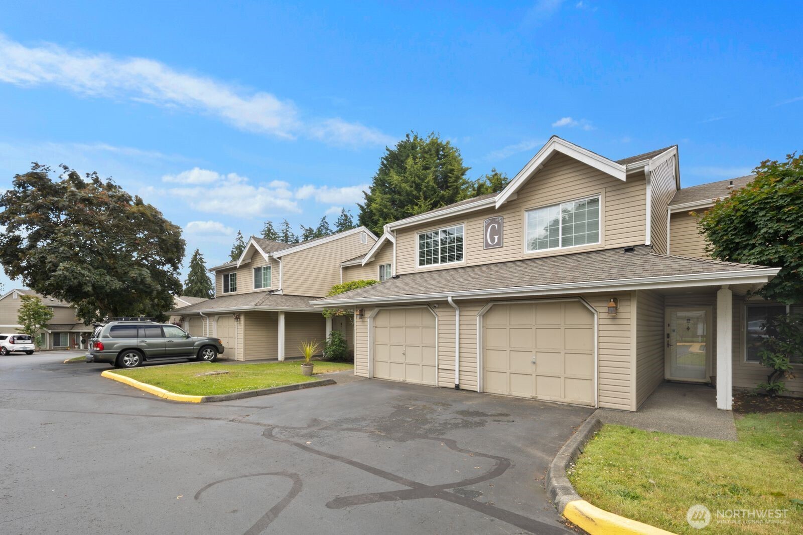 2100 South 336th Street, Unit G3 Federal Way, WA 98003 - Photo 23 of 27 a view of house with outdoor space and swimming pool