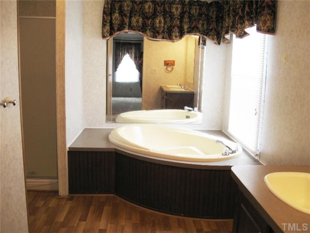2728 Edgemont Road Wendell, NC 27591 - Photo 10 of 22 Great master bathroom with double sinks, separate shower, garden tub, and LAMINATE FLOORING - no carpet in this bathroom!! Master Bath/Spa