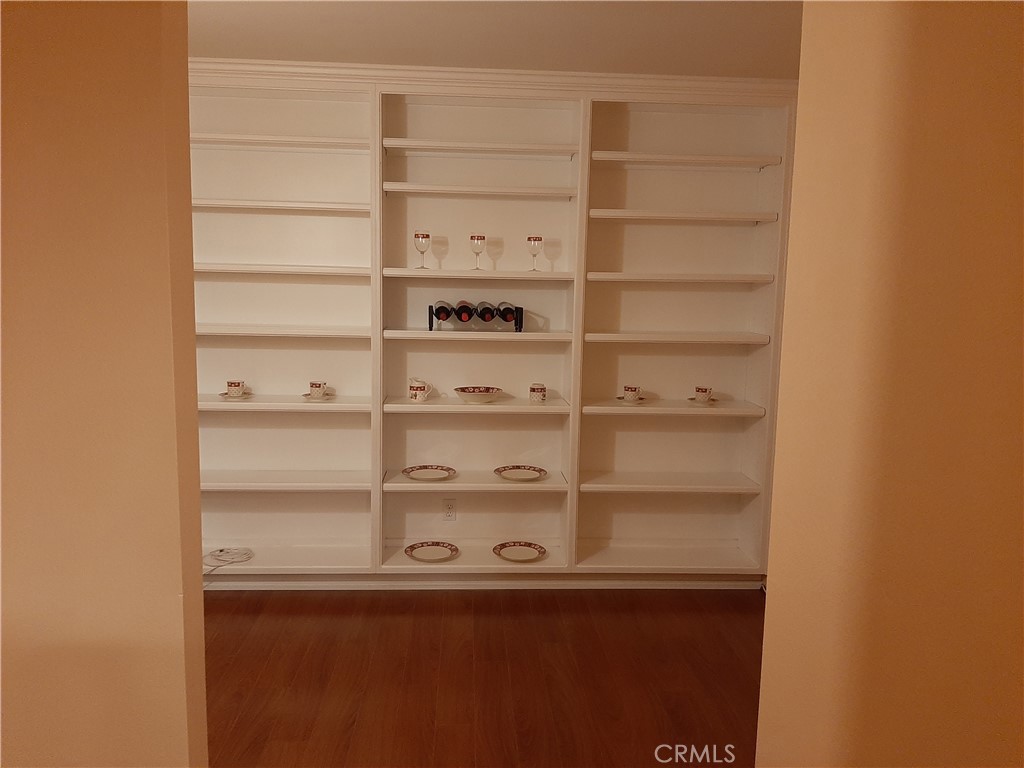 12592 Montecito Road, Unit 9 Seal Beach, CA 90740 - Photo 7 of 16 a view of a room with shelves