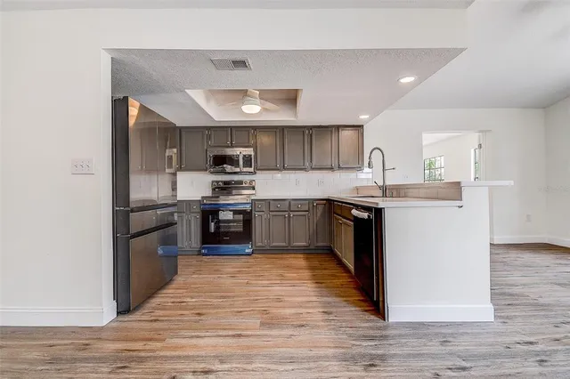 a bathroom with a sink mirror and shower