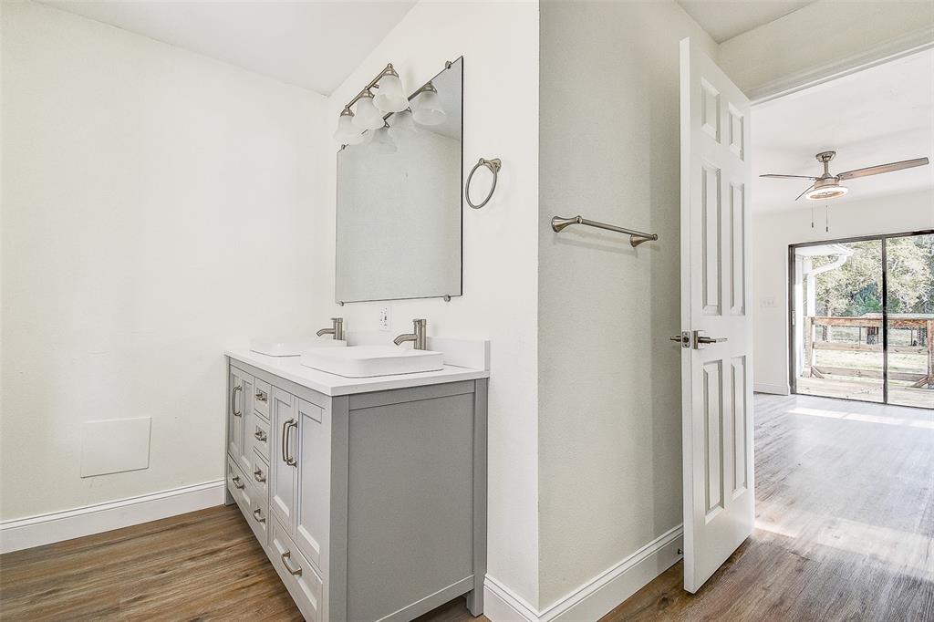 6234 Neff Lake Road Brooksville, FL 34601 - Photo 18 of 59 a bathroom with a sink mirror and shower