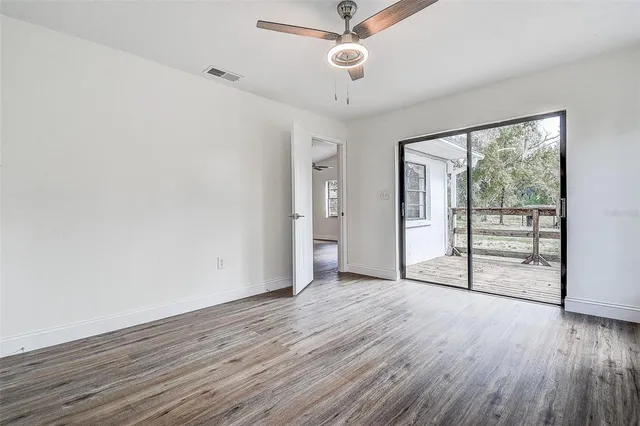 a view of a house with backyard porch and furniture