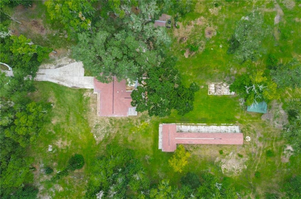 6234 Neff Lake Road Brooksville, FL 34601 - Photo 2 of 59 an aerial view of a house with a yard