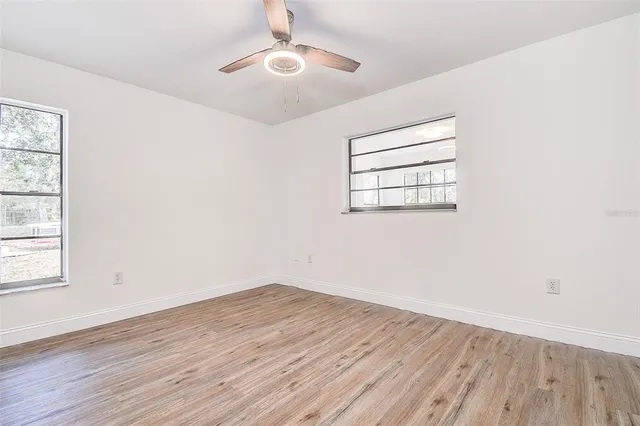 a view of a swimming pool with an outdoor seating