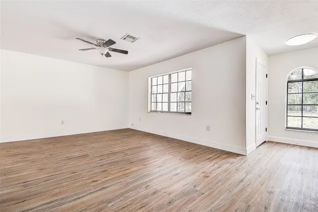 a kitchen with stainless steel appliances granite countertop a stove top oven a sink dishwasher and a refrigerator