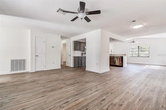 a kitchen with stainless steel appliances a sink dishwasher stove and cabinets