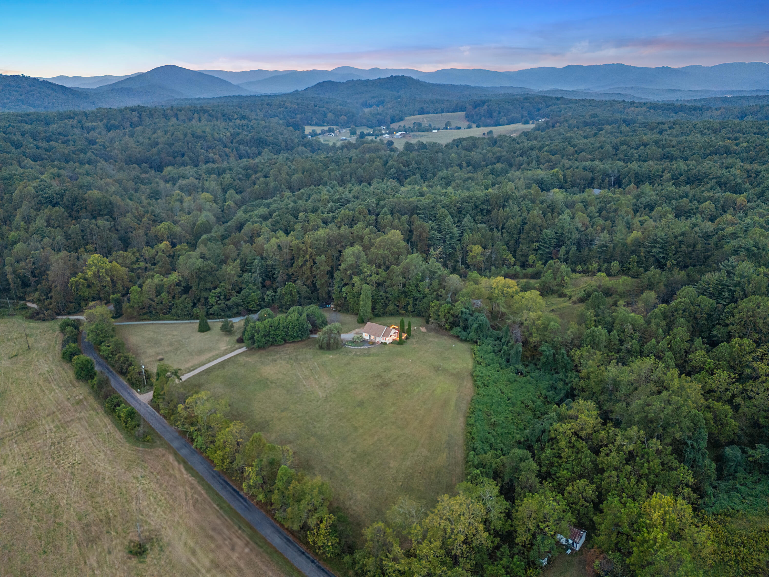 885 Whetstone Road Ferrum, VA 24088 - Photo 59 of 64 a view of a lush green hillside and a mountain view