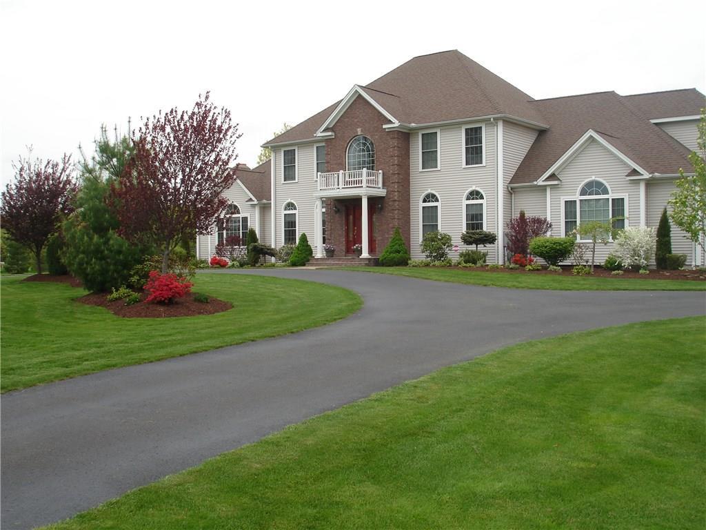 8 Jensen Farm Road Oxford, CT 06478 - Photo 1 of 1 a front view of a house with a yard