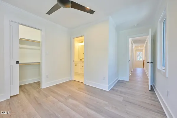 wooden floor in a hall with an empty room