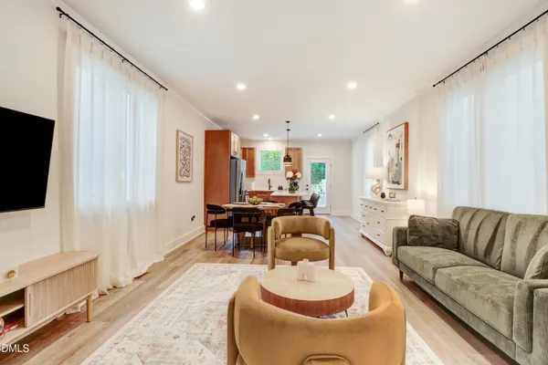 a living room with furniture and a chair