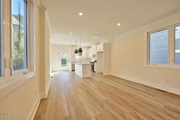 a view of kitchen with wooden floor and windows