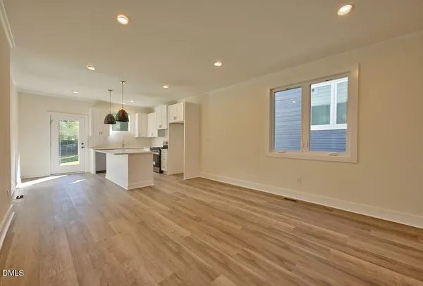 a view of kitchen with wooden floor