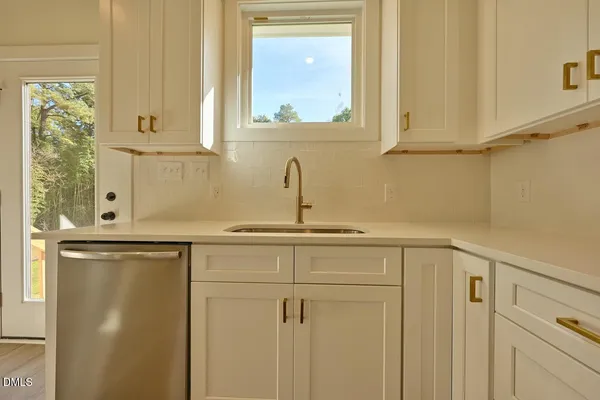 a view of a sink and cabinets