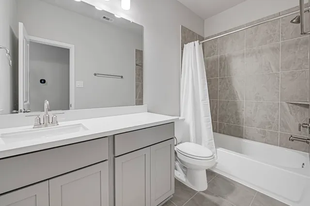 a bathroom with a sink a toilet and a bathtub
