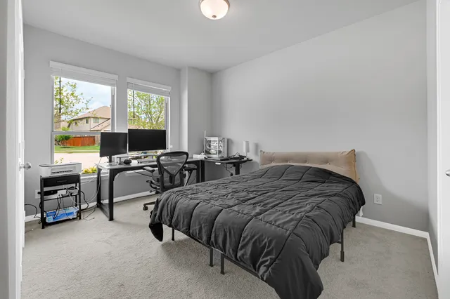 a view of a brick house with a large window