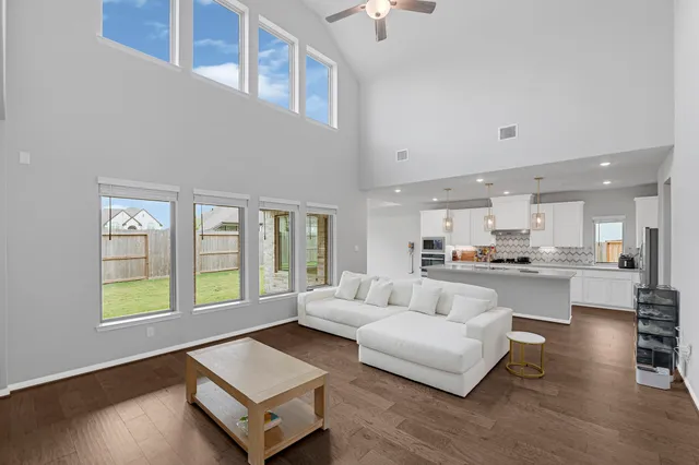 a living room with furniture and a window