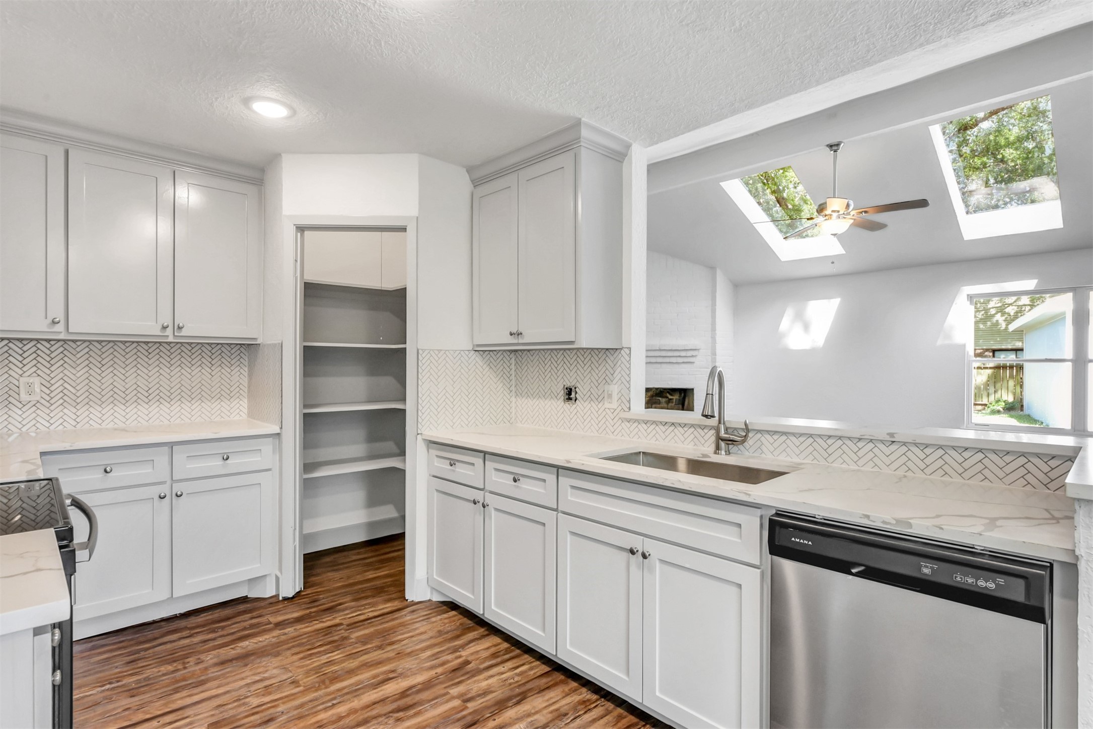 23118 Whispering Willow Drive Spring, TX 77373 - Photo 12 of 37 a kitchen with cabinets and window