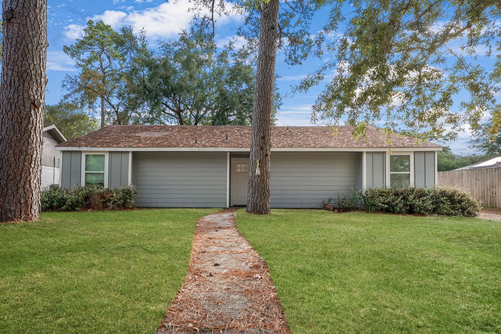 23118 Whispering Willow Drive Spring, TX 77373 - Photo 2 of 37 front view of a house with a yard