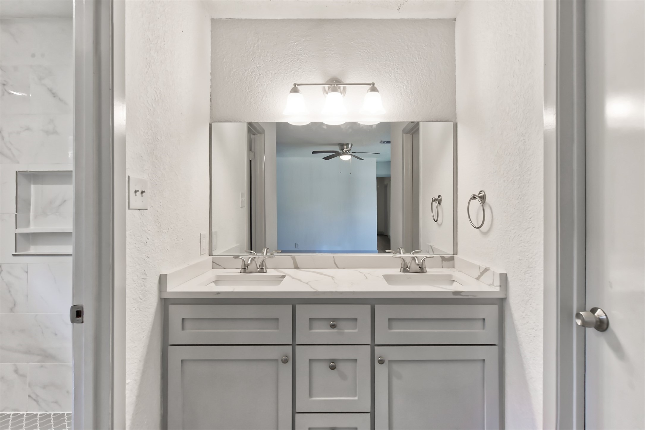 23118 Whispering Willow Drive Spring, TX 77373 - Photo 25 of 37 a bathroom with a sink vanity and a mirror