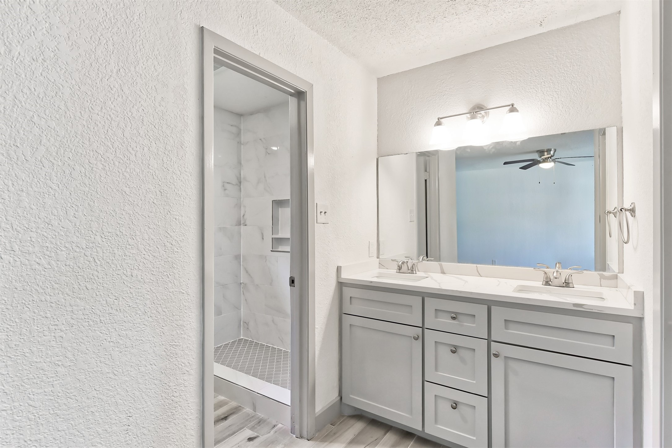 23118 Whispering Willow Drive Spring, TX 77373 - Photo 27 of 37 a bathroom with a double vanity sink mirror and