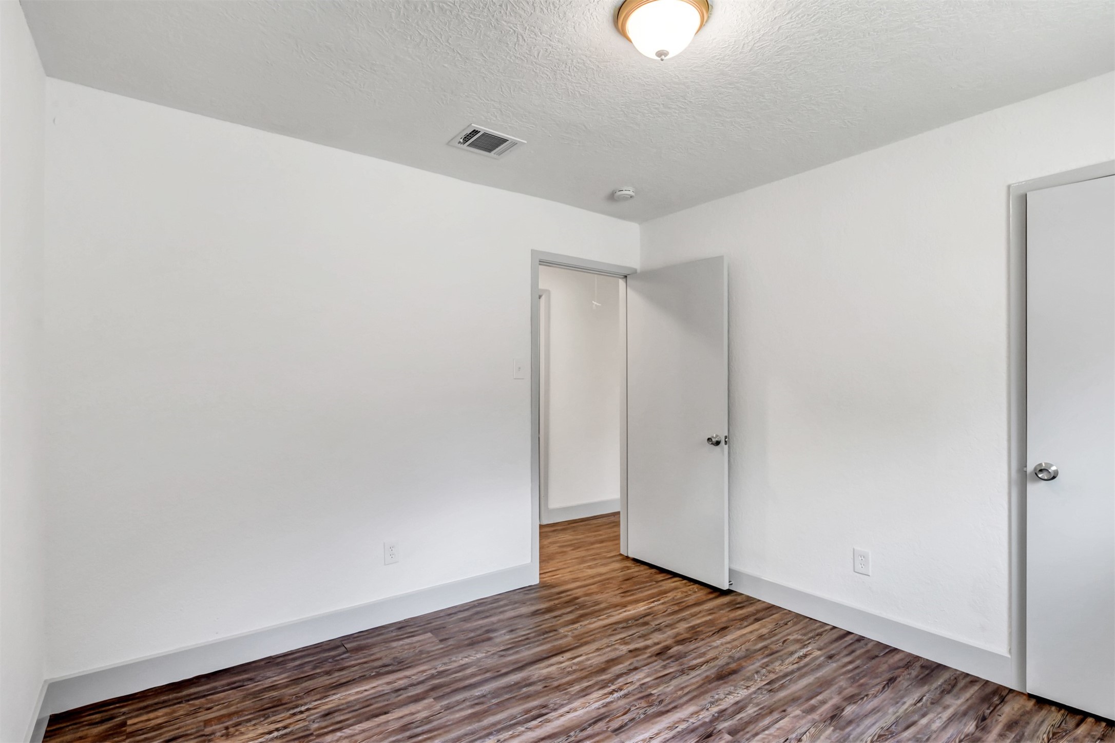 23118 Whispering Willow Drive Spring, TX 77373 - Photo 33 of 37 a view of an empty room with wooden floor