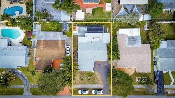 an aerial view of houses with outdoor space