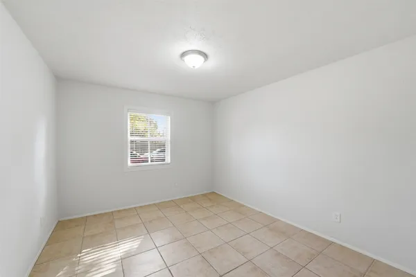 an empty room with a empty space and window