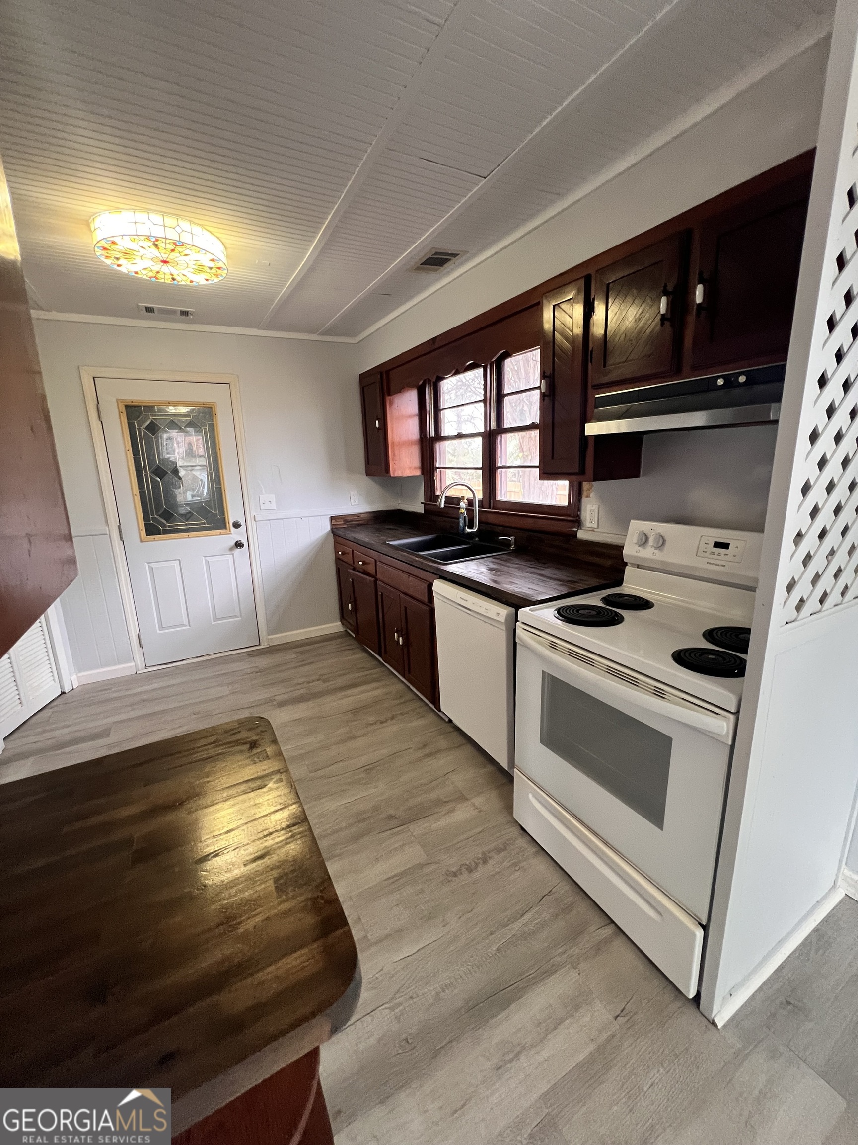 3 9th Street McRae-Helena, GA 31037 - Photo 17 of 19 a kitchen with stainless steel appliances granite countertop a stove and a sink