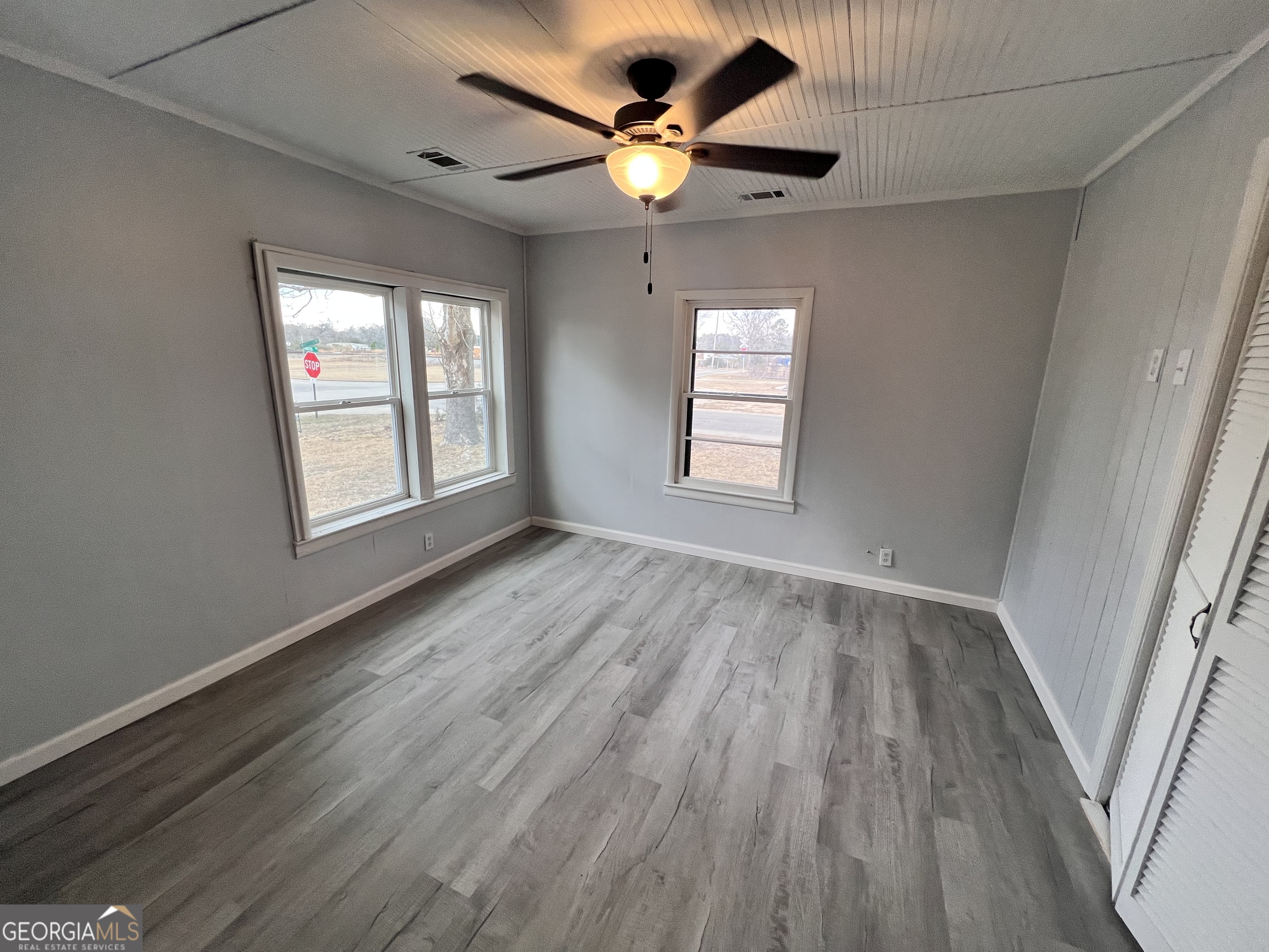 3 9th Street McRae-Helena, GA 31037 - Photo 8 of 19 wooden floor in an empty room with a window