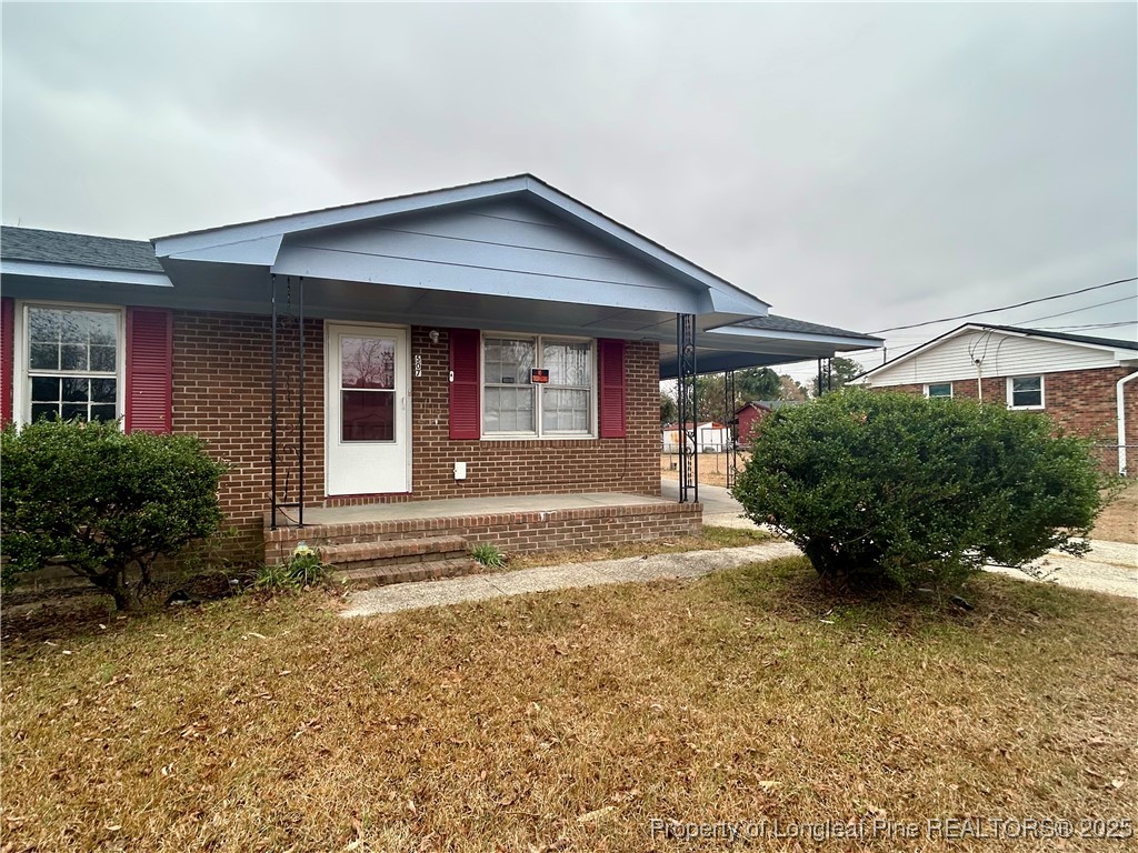 507 Oakdale Gin Road Raeford, NC 28376 - Photo 2 of 16 a front view of a house with a yard