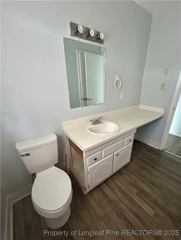 507 Oakdale Gin Road Raeford, NC 28376 - Photo 9 of 16 a bathroom with a toilet sink and mirror