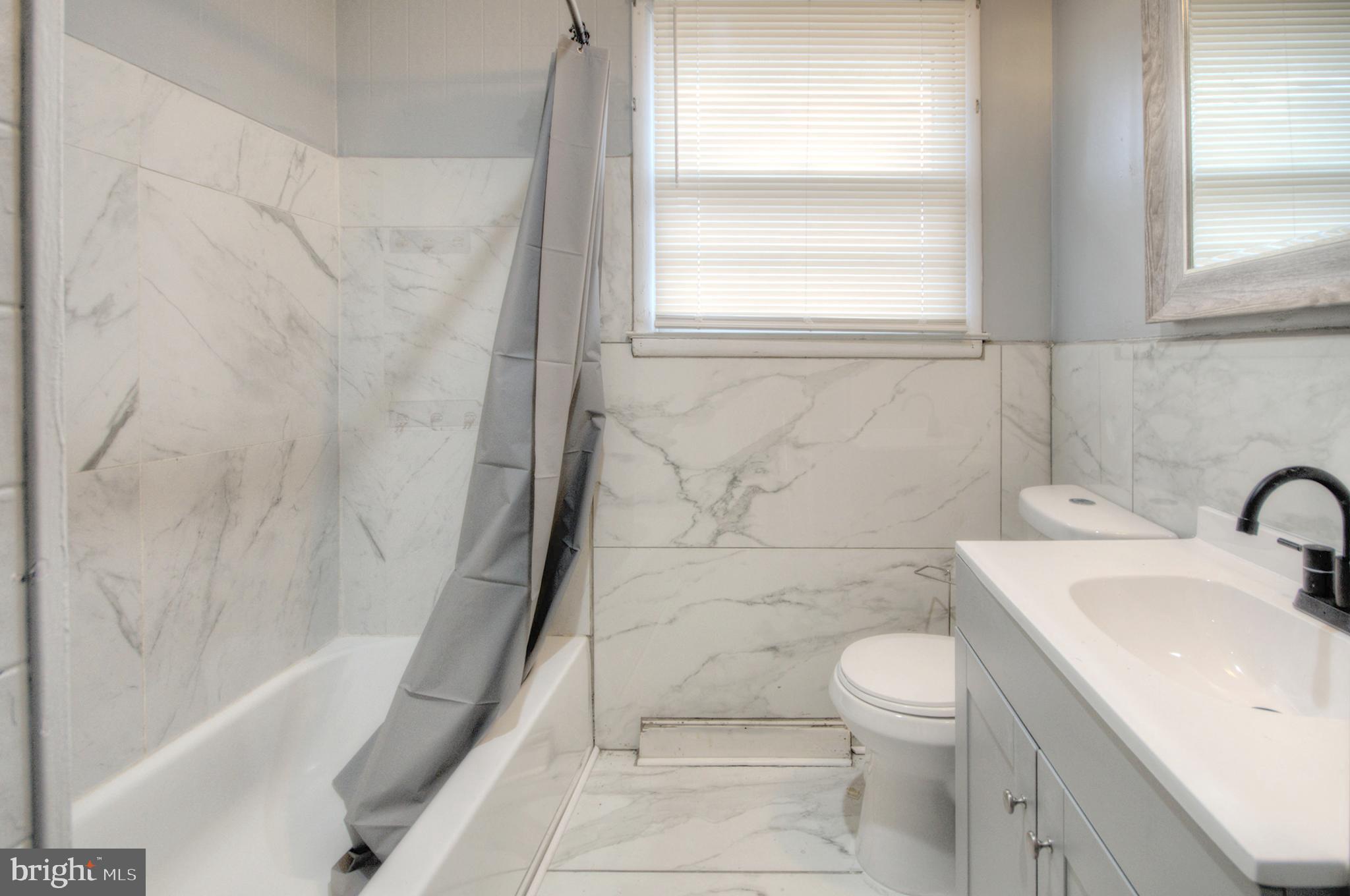 32 Fairmount Avenue Lindenwold, NJ 08021 - Photo 26 of 37 a bathroom with a sink toilet and shower