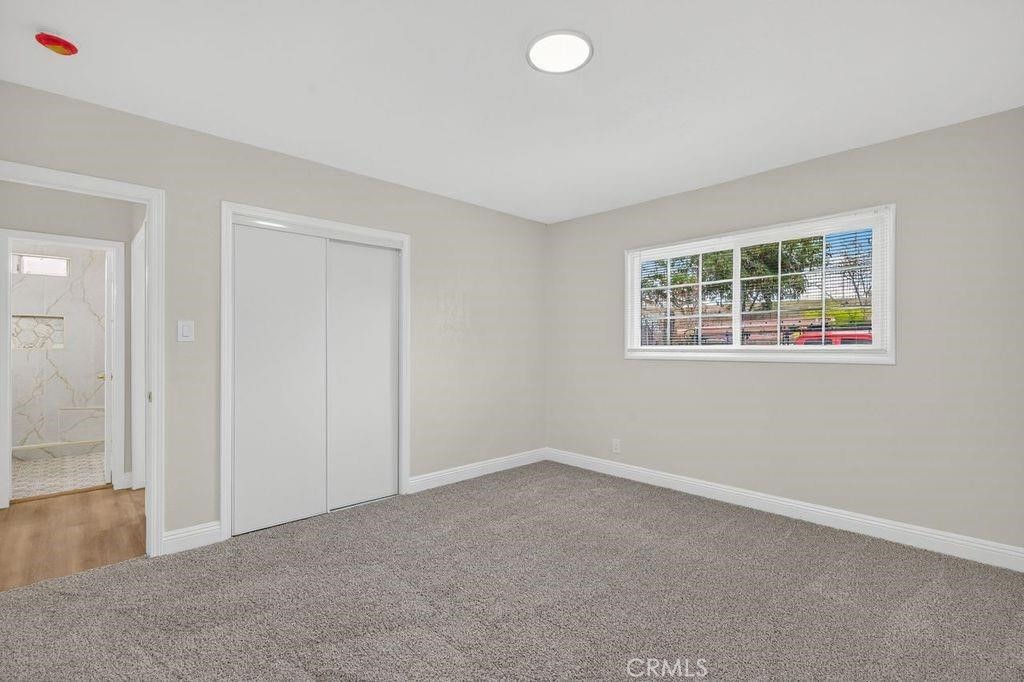 629 South Sage Avenue Rialto, CA 92376 - Photo 13 of 16 an empty room with windows