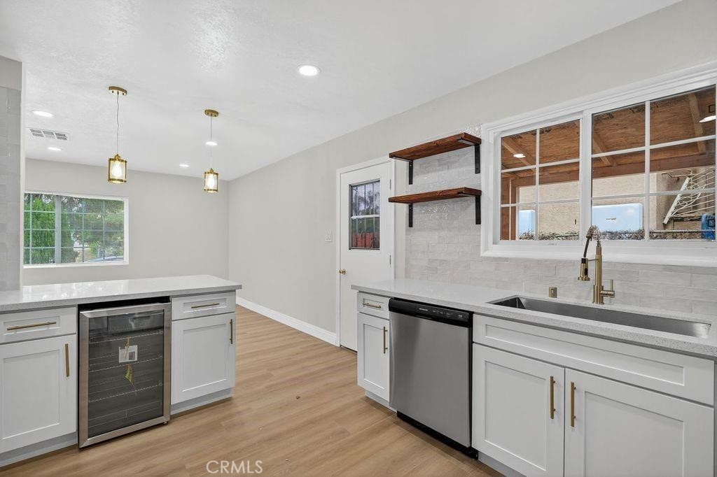 629 South Sage Avenue Rialto, CA 92376 - Photo 8 of 16 a kitchen with a sink and cabinets