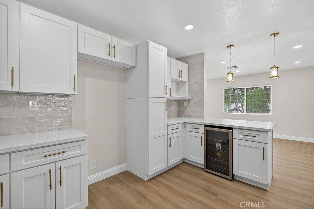 629 South Sage Avenue Rialto, CA 92376 - Photo 9 of 16 a kitchen with white cabinets and appliances