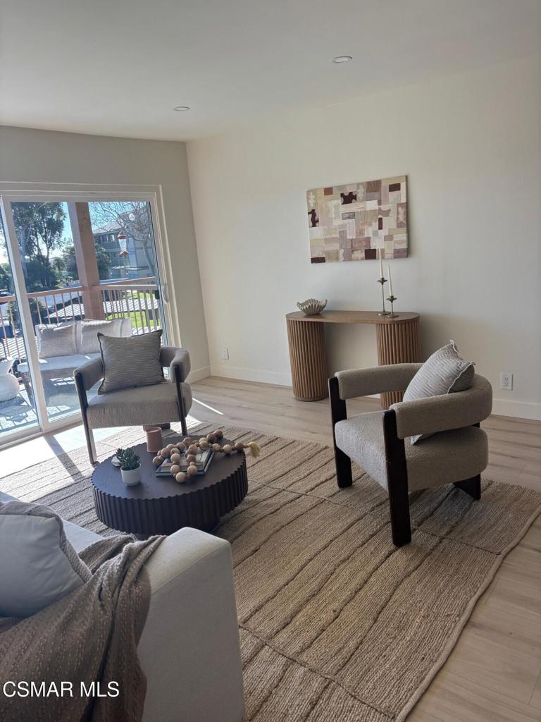 916 Lighthouse Way Port Hueneme, CA 93041 - Photo 4 of 26 a living room with furniture and a large window