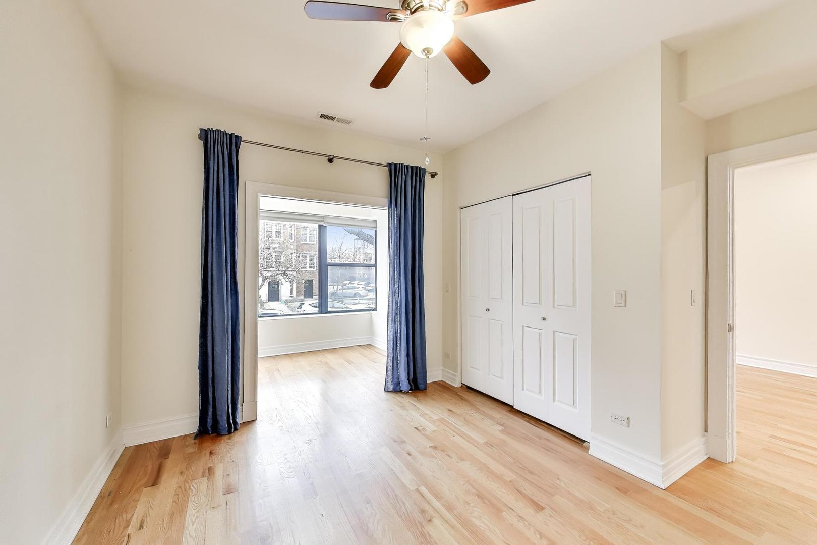 1640 West Fargo Avenue, Unit 101 Chicago, IL 60626 - Photo 11 of 22 a view of empty room with wooden floor