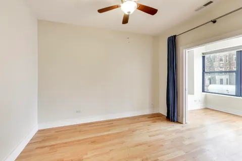 an empty room with a empty space and windows